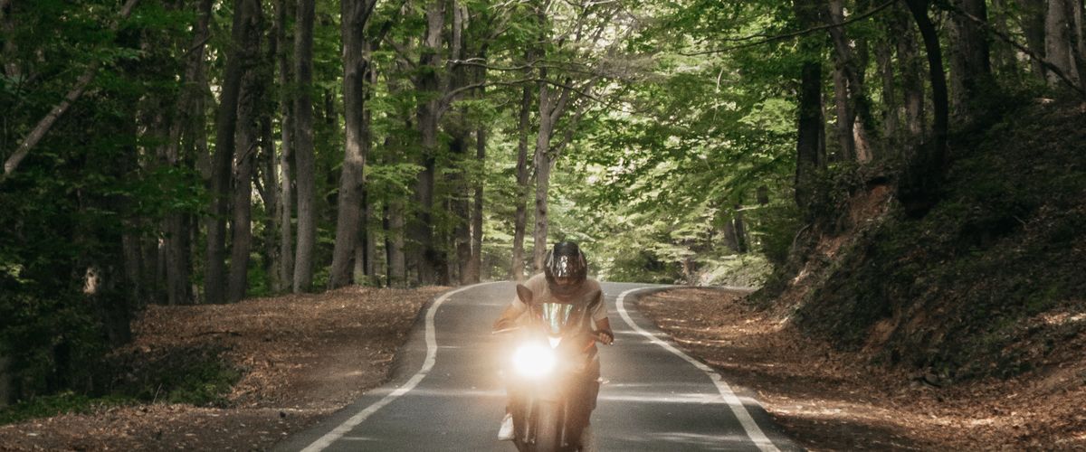 Motorcyclist riding on an open road